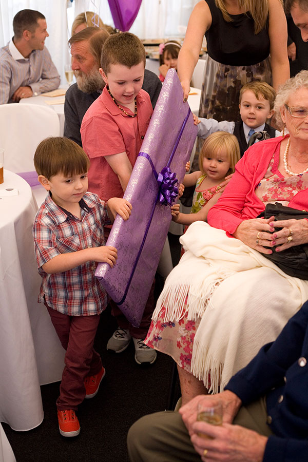 Grandchildren with Present for the Bride and Groom by Kelliejo Photography