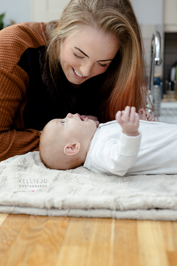 newborn baby with mum during a newborn family photoshoot at home