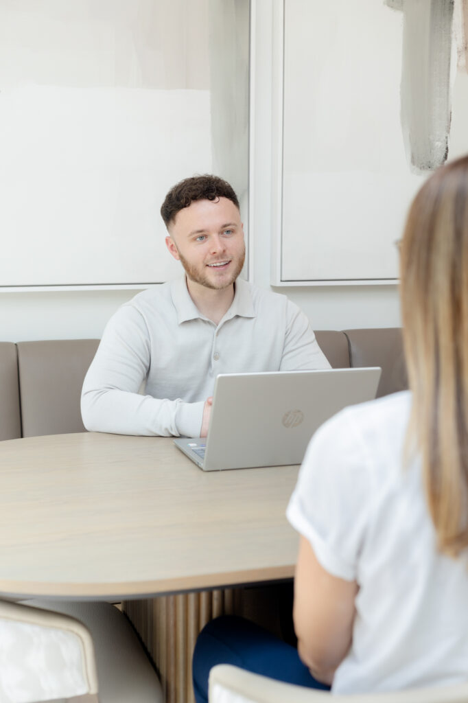 personal branding image of a young male entrepreneur talking to a client