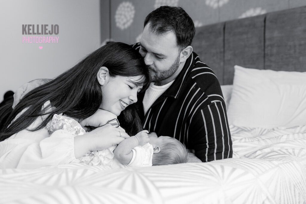 family during a newborn photography shoot at home